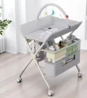 Посилений пеленальний столик з органайзером та аксесуарами, колеса, іграшки, пелюшка, сірий колір, 7 кг