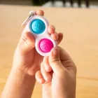Брелок антистрес Fat Brain Toys Simpl Dimpl Кнопки 4 кольори в асорт (F2111ML)
